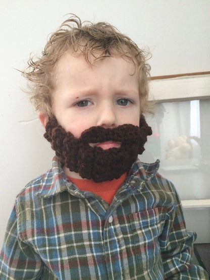 brown crocheted beard on toddler