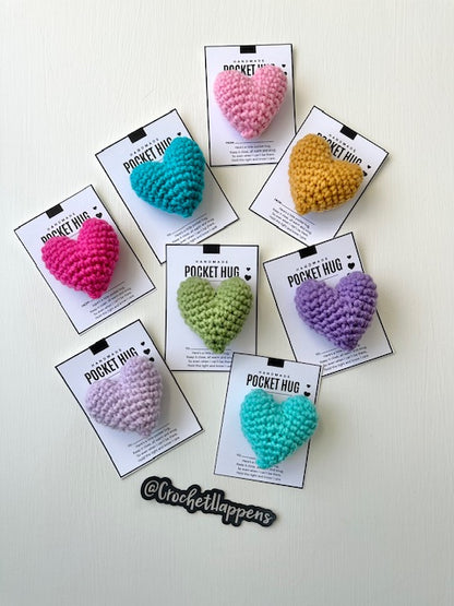 collection of hand crocheted pocket hugs stuffed hearts on gift cards